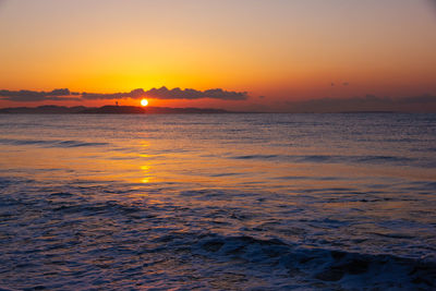 Scenic view of sea against romantic sky at sunset