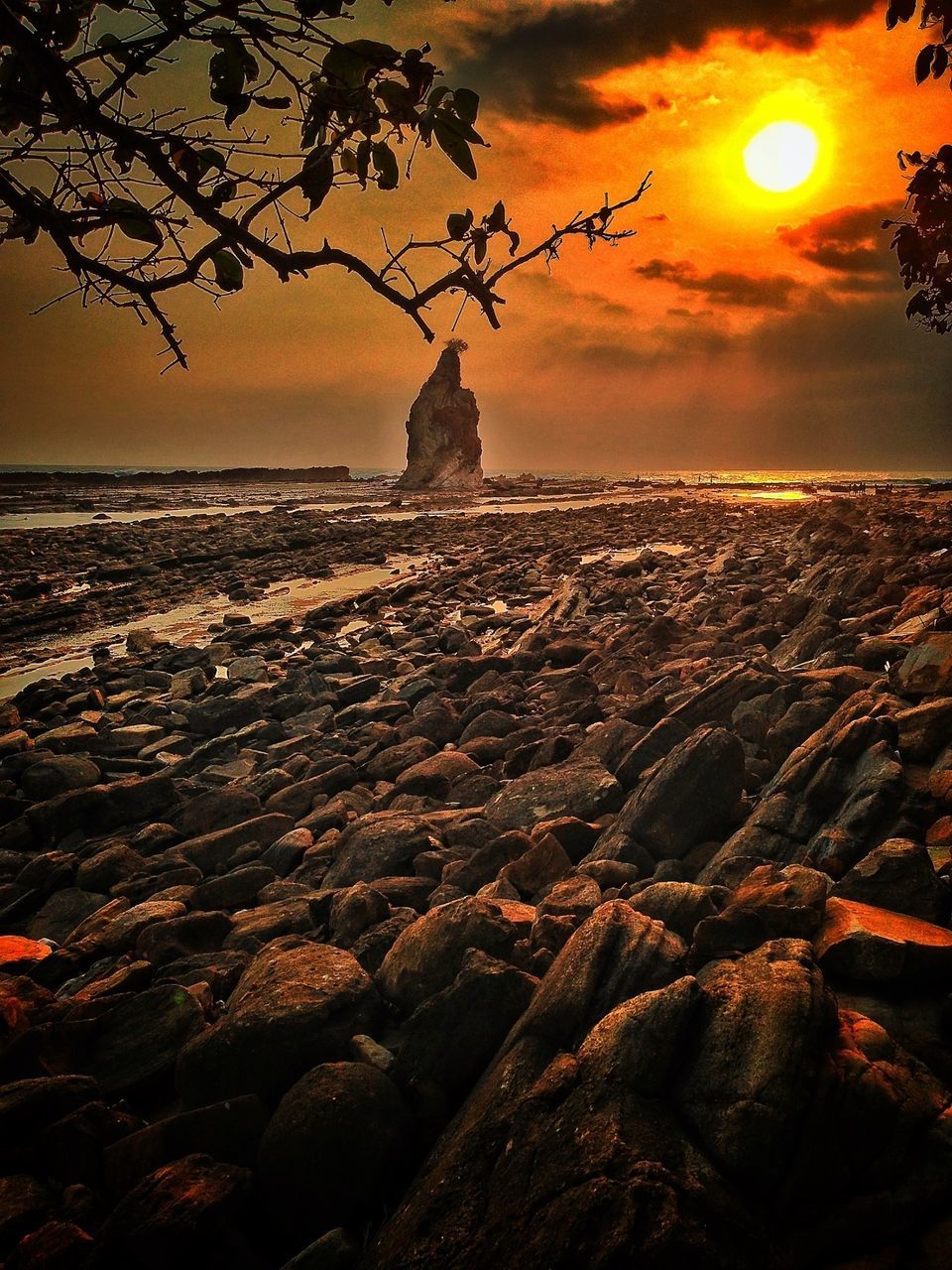 sunset, sun, sea, sky, scenics, orange color, horizon over water, tranquil scene, tranquility, nature, beauty in nature, water, sunlight, idyllic, rock - object, beach, cloud - sky, lens flare, sunbeam, outdoors