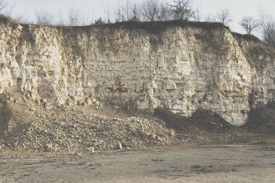 Rock formation on land against sky