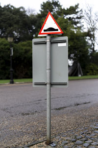 Close-up of road sign on street