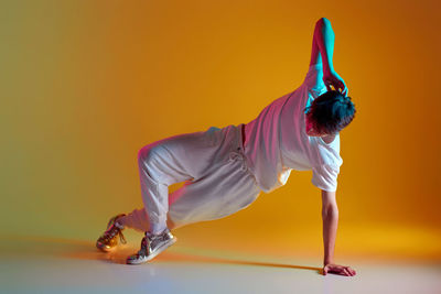 Low section of woman exercising on field