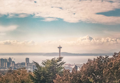 Scenic view of lighthouse and buildings against sky