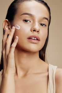 Close-up of young woman holding bottle