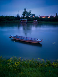 Boat in river against sky