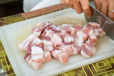 High angle view of person preparing food on cutting board