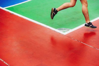 Low section of man playing at sport court