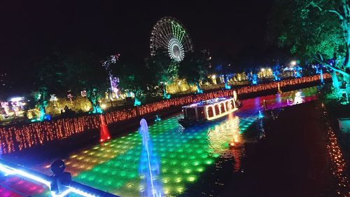 Firework display in city at night