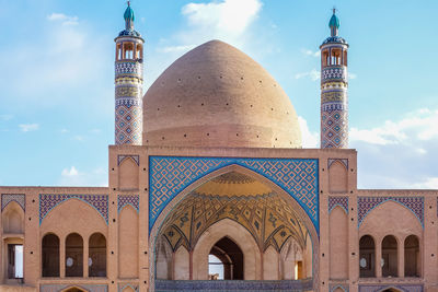 Low angle view of mosque against sky