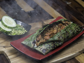 High angle view of fish in plate on table