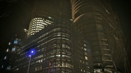 Low angle view of modern building at night