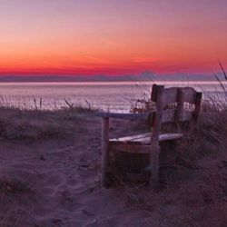 Scenic view of beach against sky during sunset