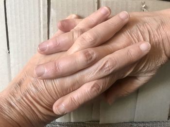 Close-up of hand touching hands