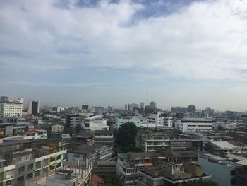 High angle view of buildings in city against sky