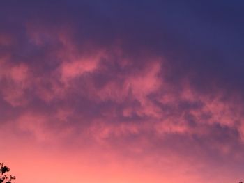 Low angle view of dramatic sky during sunset