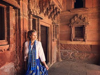 Woman standing in historic building