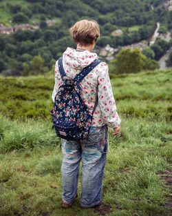 Woman overlooking countryside landscape