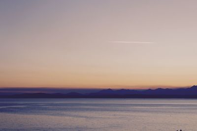 Scenic view of calm sea at sunset