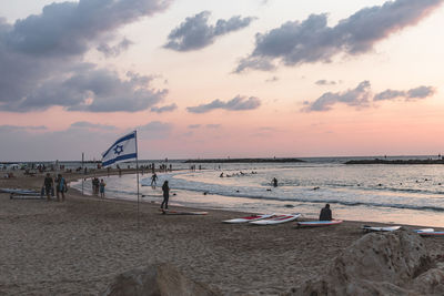 Scenic view of beach against sky during sunset