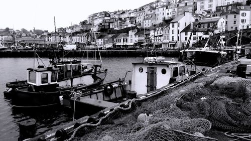 Fishing boats moored at harbor