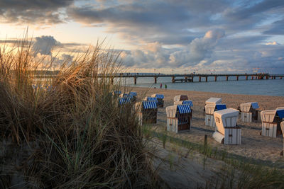 Scenic view of beach against sky during sunset