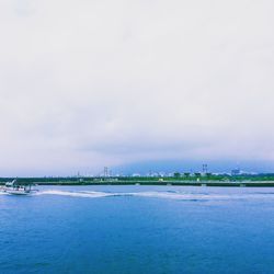 View of city against cloudy sky