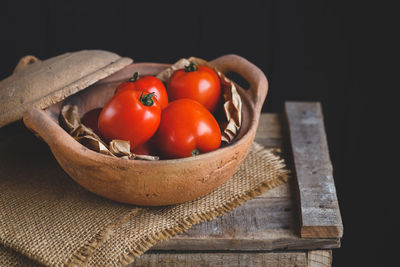 Close-up of tomatoes in basket on table