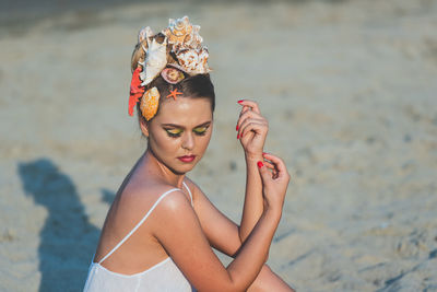 Portrait of woman wearing sunglasses at beach