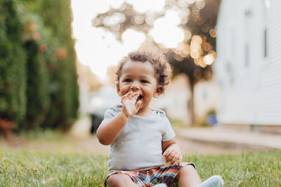 Portrait of smiling boy in grass