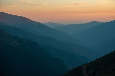Scenic view of mountains against sky during sunset