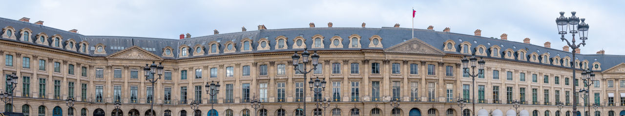 Low angle view of office building against sky