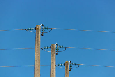 Poles aligned with electric wires