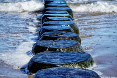 Close-up of stones in river