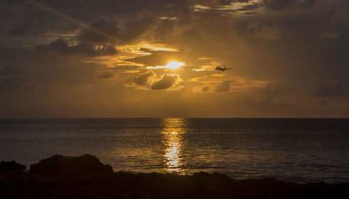 Scenic view of sea against sky during sunset