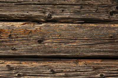Old rustic wooden planks eaten by caries