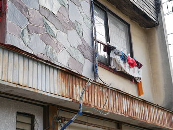 Low angle view of clothes drying on building