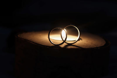 Close-up of wedding rings on the dark