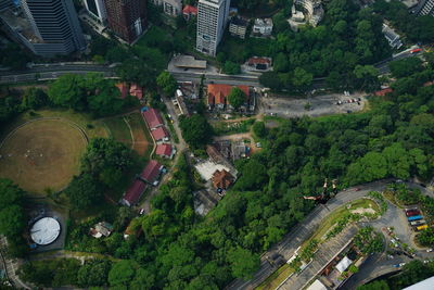 Aerial view of men base jumping over city