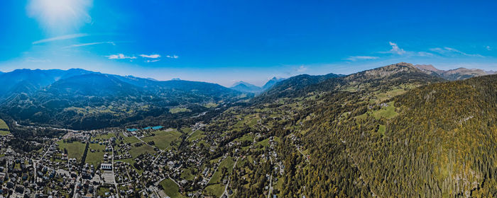 Scenic view of mountains against blue sky