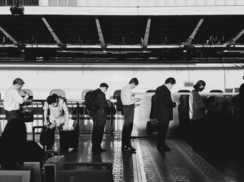 Group of people at railroad station platform