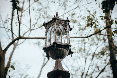 Low angle view of street light against building