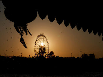 Scenic view of silhouette landscape against sky at sunset