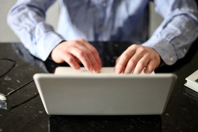 Close-up of man working on table