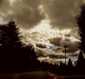 Scenic view of road against cloudy sky