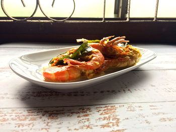 Seafood buttermilk served in plate on a table