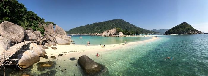 Panoramic view of sea and mountains against sky