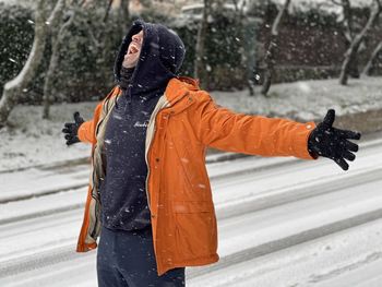 Person holding umbrella during winter