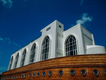 Low angle view of building against blue sky