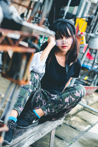 Young woman sitting outdoors