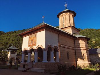 Low angle view of church against clear blue sky