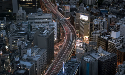 High angle view of illuminated buildings in city